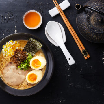 Bowl of Japanese Tonkotsu ramen with spoon and chopsticks